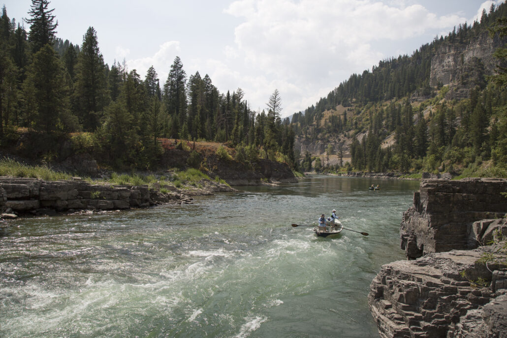 A drift boat floats down the Snake River.